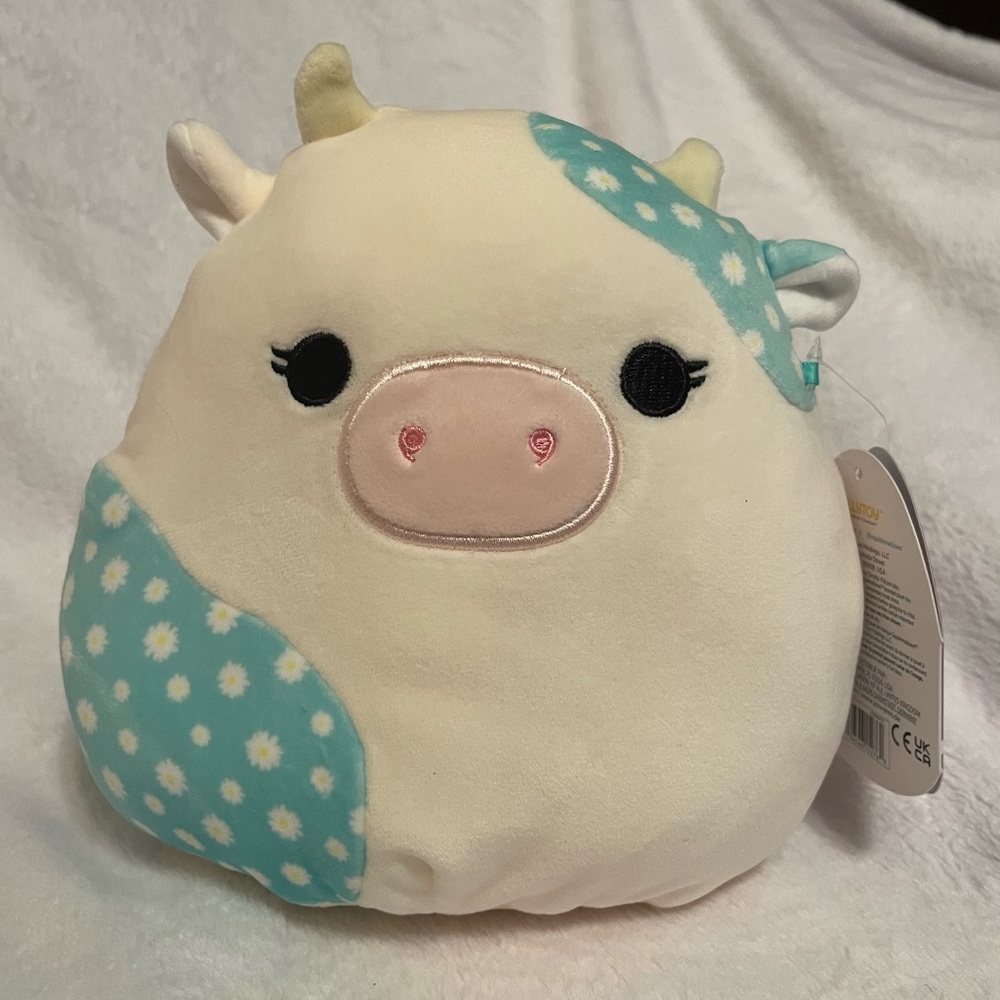 NWT Squishmallow Belana the Cow blue with daisies Easter 8”